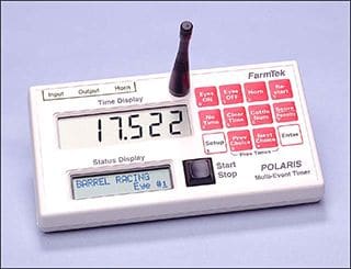 A FarmTek Polaris timing console, its display reading 17.522 seconds.